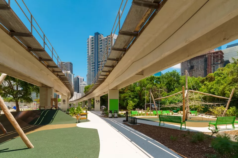 Pedestrian and bike trail under Miami Metroline elevated tracks.